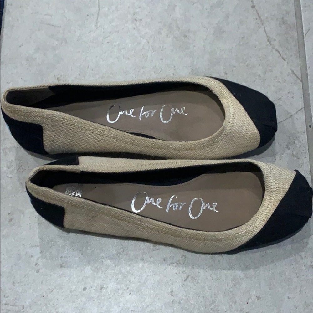 Tan and black Toms, size 6.5.